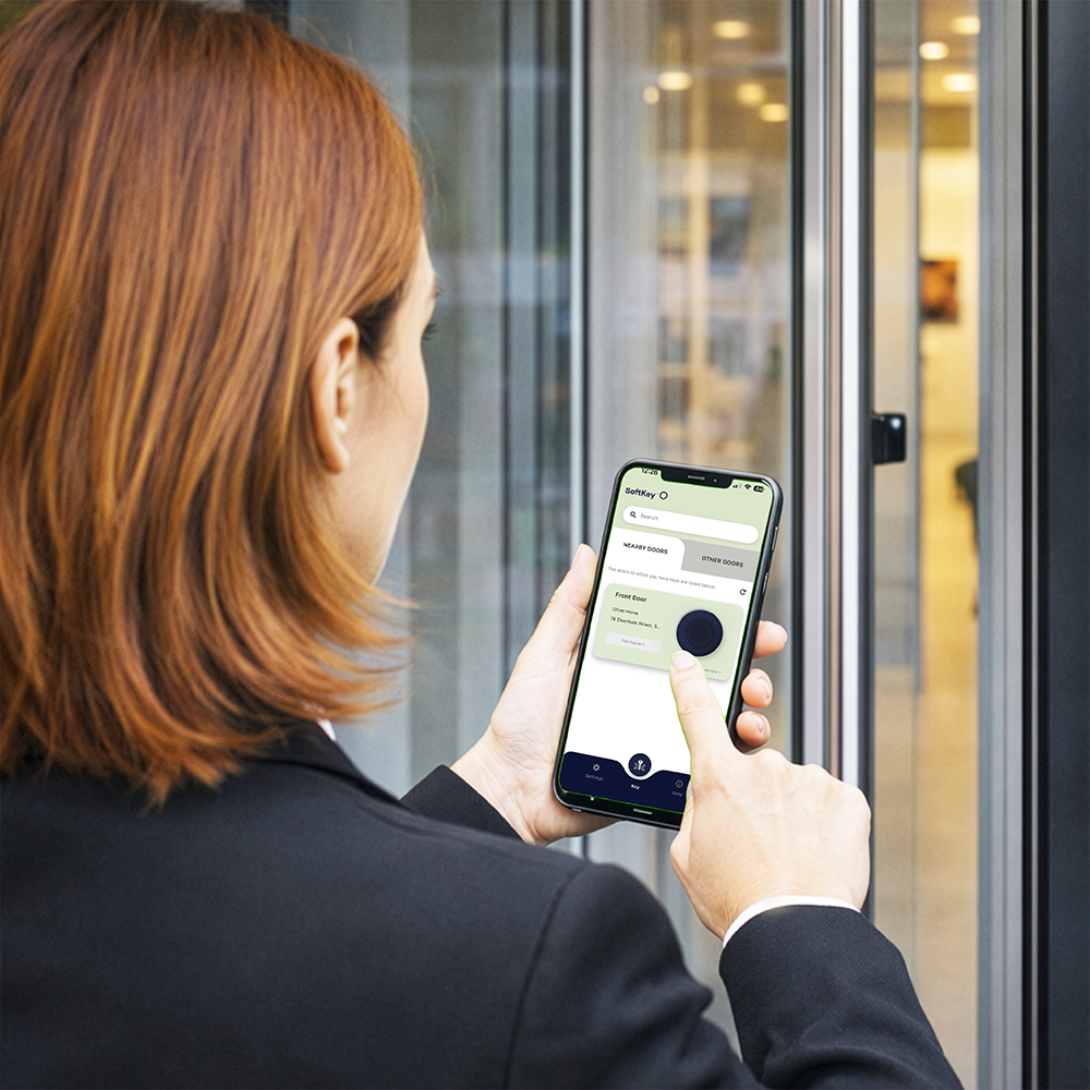 Person using SoftKey smartphone access at a door